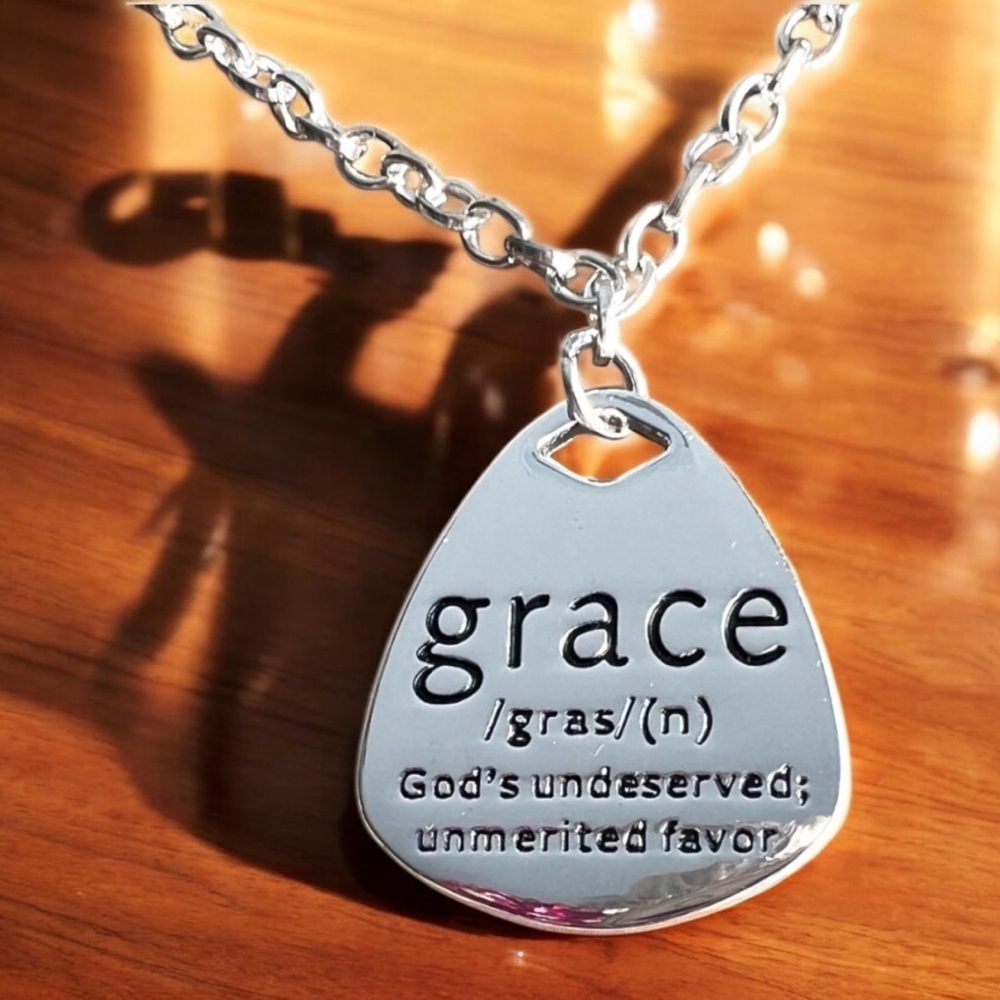 Grace Pendant Necklace in Silver toned and stainless steel. 18” long